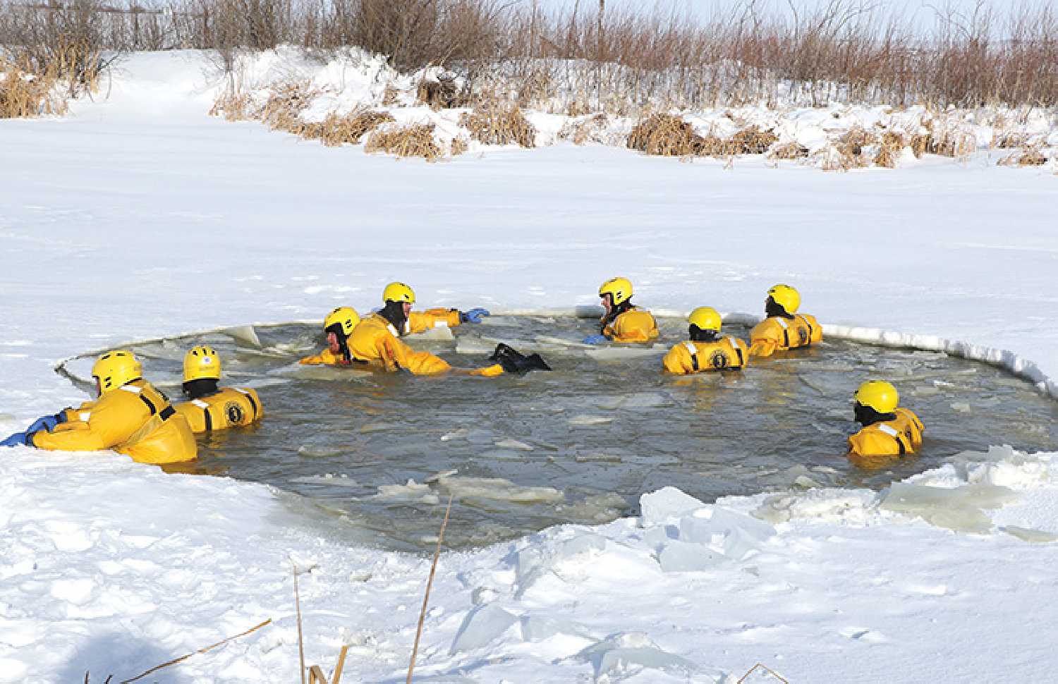 Twenty firefighters from Redvers, Carnduff and Carievale participated in a water rescue course last weekend in Redvers. Above are a few firefighters training in -23 C weather. The team was out there all day learning and training.